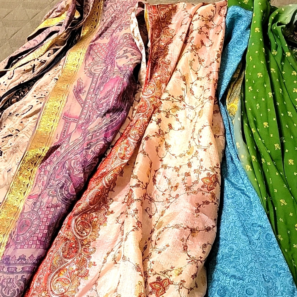 Three long layered multi-pattern skirts with cloth ties